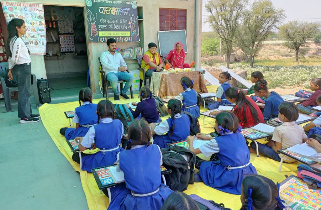 Visitor Guest interacting with beneficiaries girls