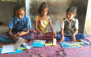 Distributing educational materials to needy child