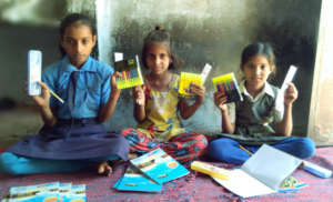 Distributing educational materials to needy child