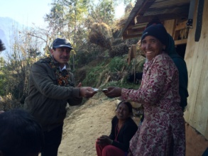 Village woman receiving stipend to buy door