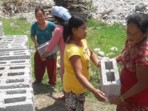 Bricks are unloaded for the kids' new classrooms