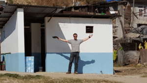 James in front of the completed toilets