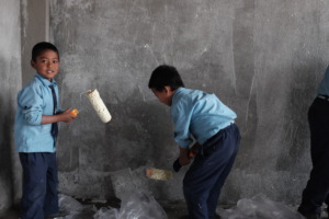 The kids make a start on the walls