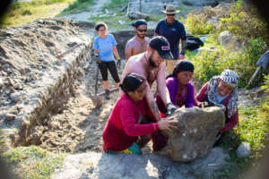 Working together to dig the septic tank