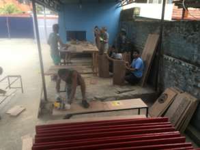 Now we're building furniture for the classrooms