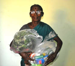 Elder women receiving food groceries