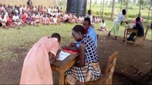 Justine with her teacher and social worker