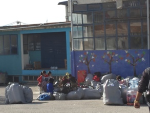 Residents being loaded on buses to go to Athens