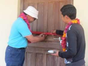 EBMF Chairperson cutting the ribbon in Dokotar