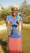 Jesca taking fishes for her family
