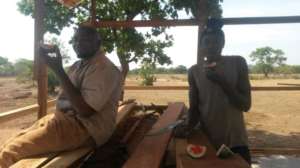 Evarist  & Steven eating water melon