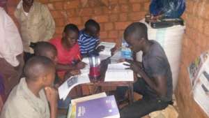 school students studying with solar light
