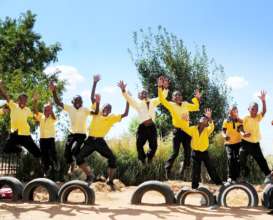 The boys of fourth grade jumping for joy