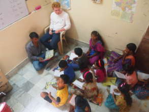 Another volunteer teaching English and Maths