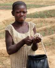 Linetta O carrying water for the work