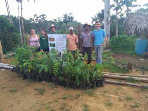 Edivaldo, family and friends receiving seedlings