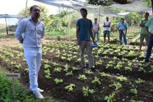 Gui sharing his experience with local farmers