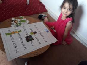 Little girl working on edu-kit