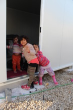 Happy children in new containers