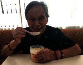 Grandma Kam trying out our new cook-chill congee!