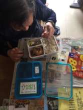 Grandma Ng enjoying her delivered hot meal box