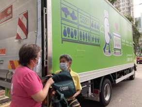Granny May and our staff with our cooling truck