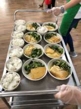 Hot meals served on food trolley at the Centre