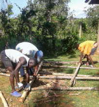 Boys working on chicken fence