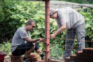 A volunteer assembling steel super structure