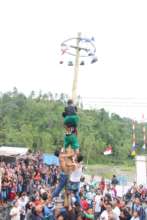 "Panjat Pinang" climb up a slippery pole