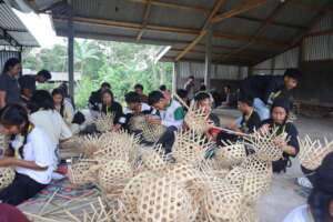 Learning bamboo weaving in Bali Woso Outbound