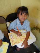 Primary school girl proud of her art work