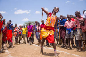 A Maasai warrior throws a rungu in competition