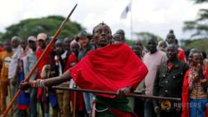 Maasai warrior competing in javelin event.