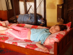 Andee likes her new bed - all in her favourite colour, pink!