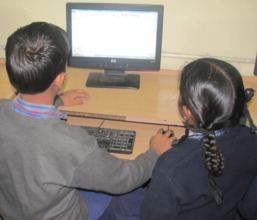 Children learning computers at AWC