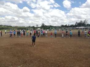 Adolescent  Girls and Young Moms playing football