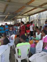 Nurses having a session with young moms