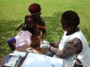 Taking blood samples to test for Malaria