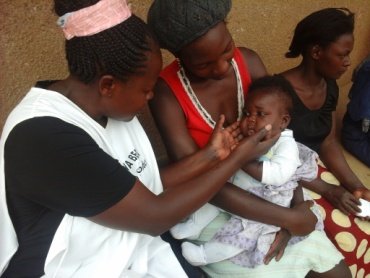 A baby being physically examined.