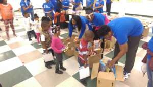 TYC Youth Passing out Toys and Books in Flint.