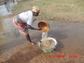 Traditional collection of water at Nyorugu
