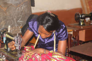 Ramatu sewing using new machine