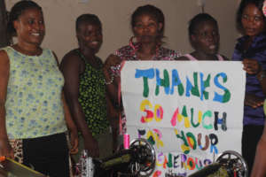 Ramatu and other trainees holding Thank You sign