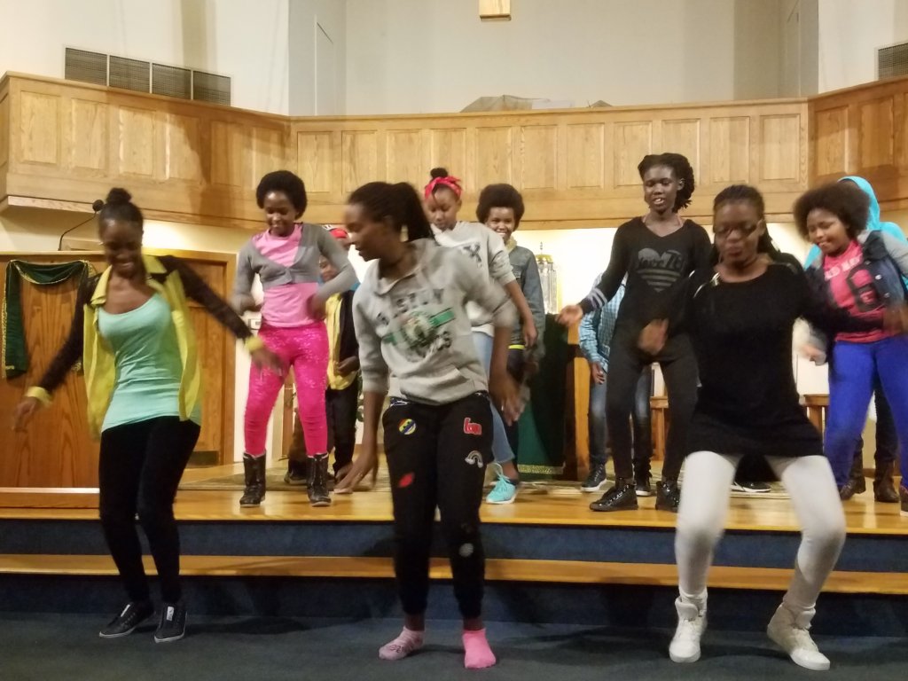Dancing at an interfaith vigil.