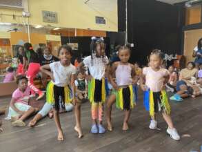 Chicago girls in Tanzanian flag skirts for show