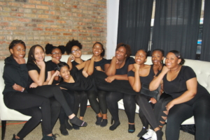 Girls pose prior to a performance