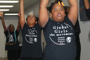 Girls dancing in "the movement" shirts