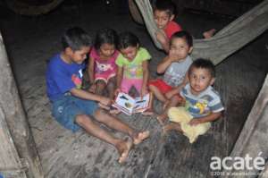 Matses children with reader