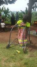 Using her walking frame to get around